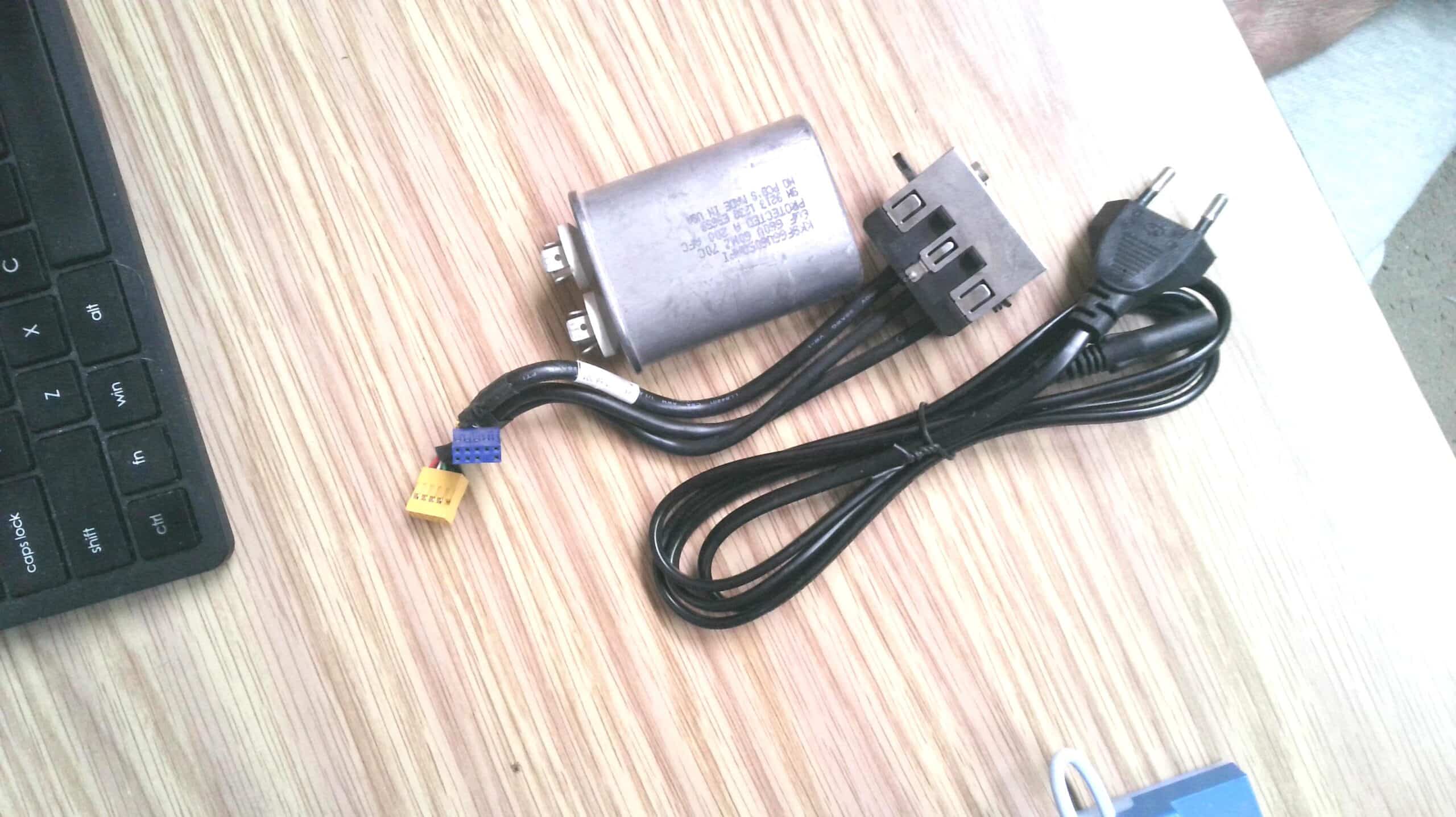 Box of assorted capacitors/resistors/cables etc. –